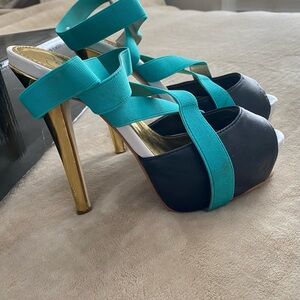 Colin Stewart statement platform heals - Gold/Black/White/Teal